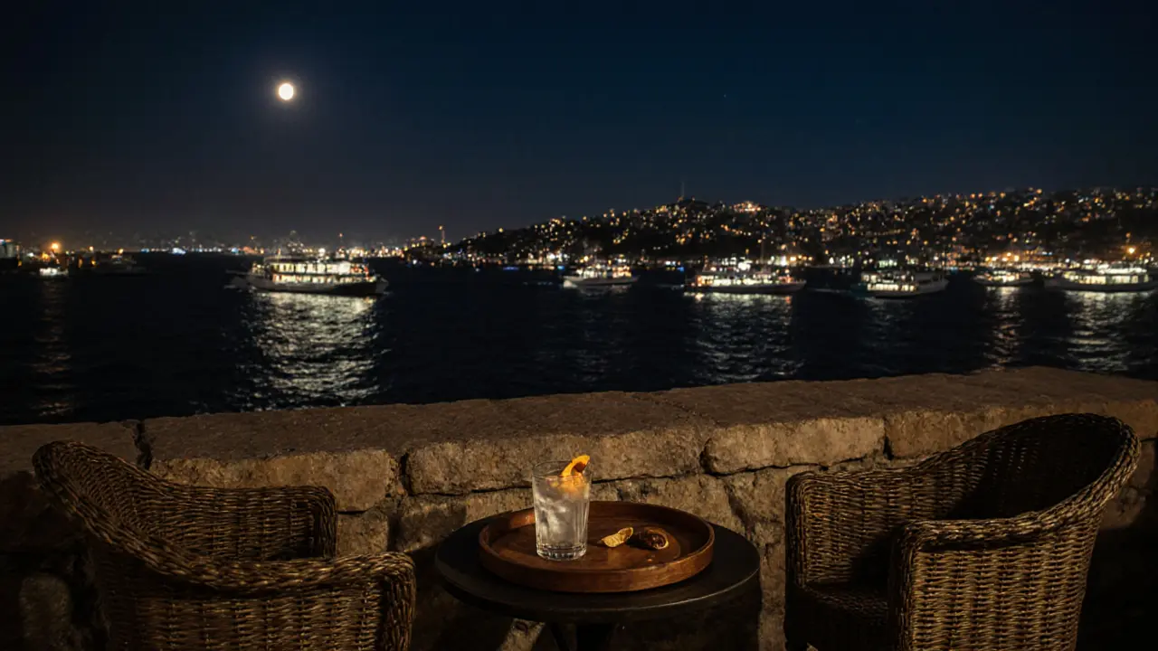 A peaceful rooftop terrace at night with a view of the Golden Horn and a single drink on a wooden tray.
