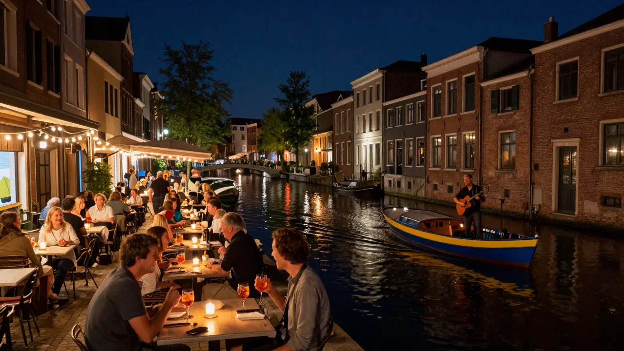 Vibrant outdoor tables along a canal at night, with live music and boats floating under string lights.