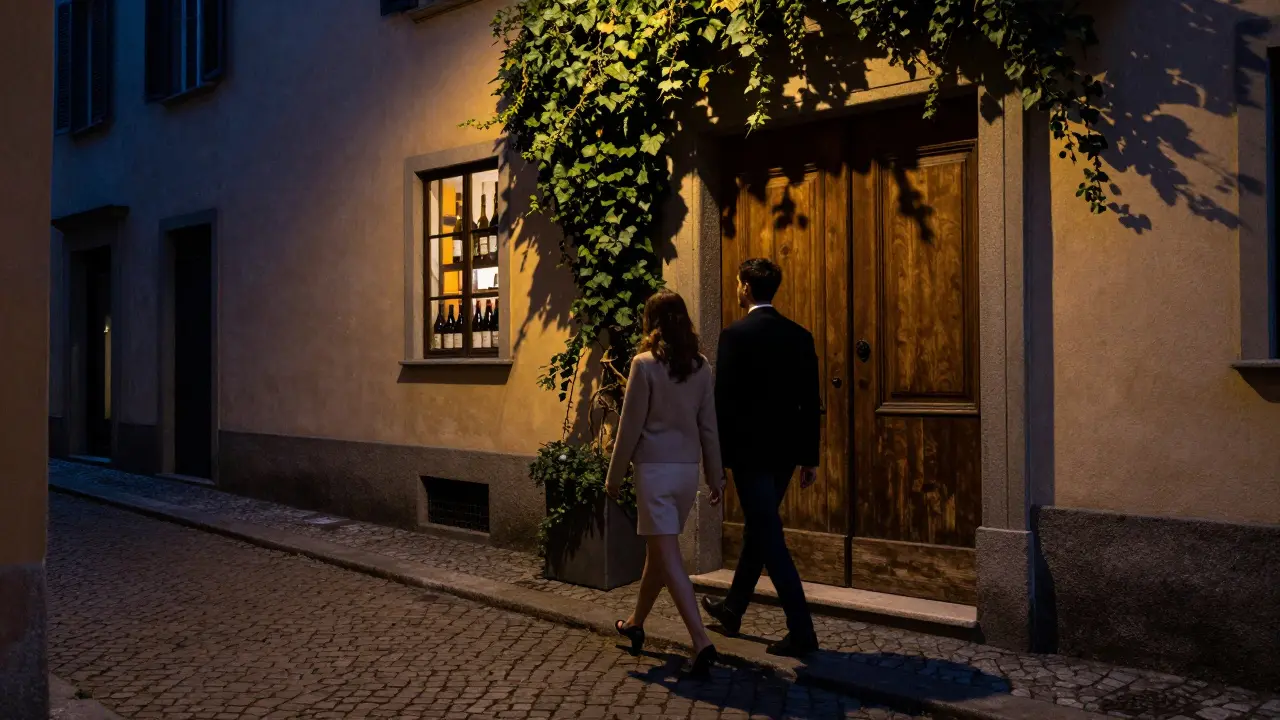Couple walking down a narrow cobblestone street in Brera at night.